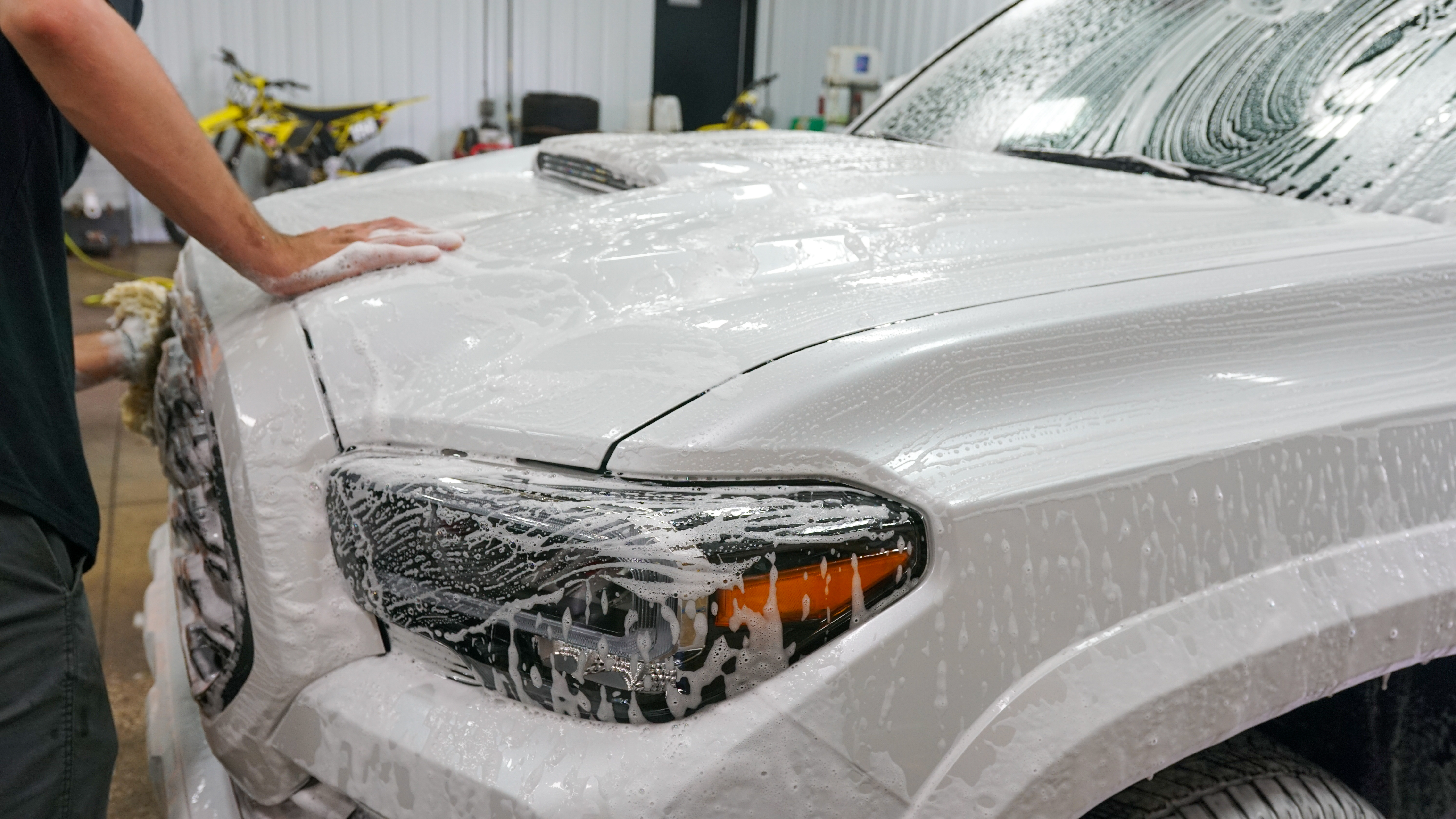 White truck being foam washed